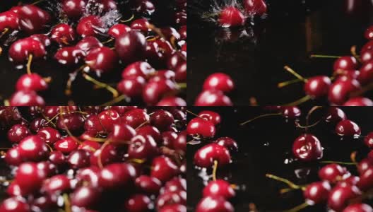 樱桃浆果落在水面上，在黑色背景的慢镜头下弹回来高清在线视频素材下载