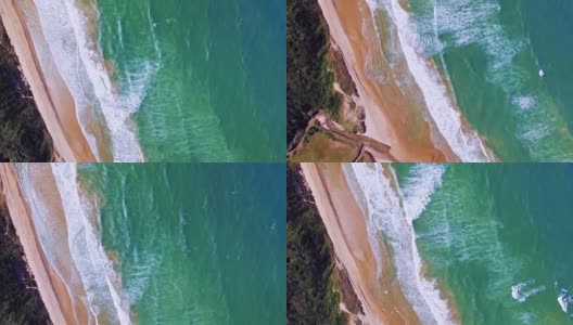 无人机拍摄美丽的海浪涌向沙滩高清在线视频素材下载