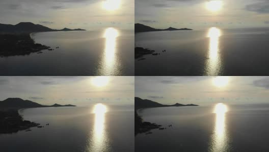 美丽的天堂岛鸟瞰图与海滩和大海周围的椰子树在日落时间高清在线视频素材下载