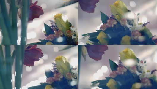 透过花店的橱窗，你可以看到许多不同的鲜花和花束高清在线视频素材下载