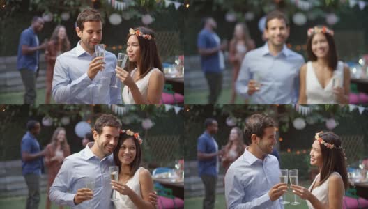 年轻夫妇在后院庆祝婚礼高清在线视频素材下载