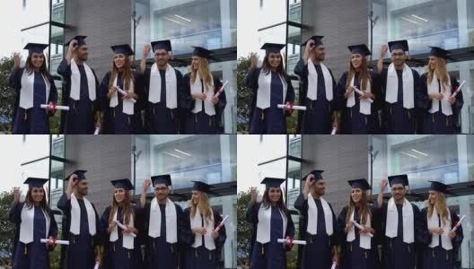 一群美丽的学生扔着毕业帽兴奋地庆祝高清在线视频素材下载