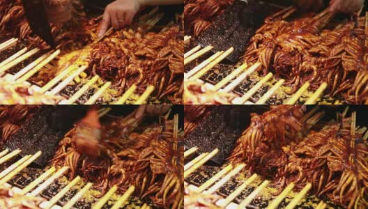 北京菜市场上的街头小吃——鱿鱼和章鱼高清在线视频素材下载