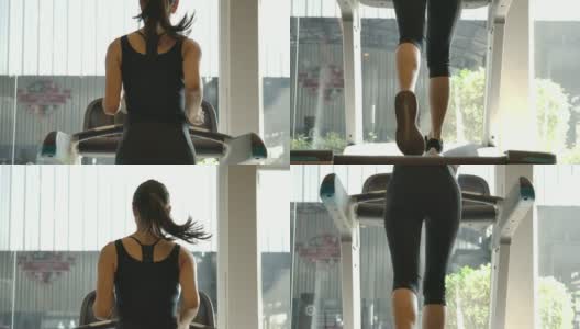 亚洲女性在健身房里跑步机上跑步的背影。慢动作。高清在线视频素材下载