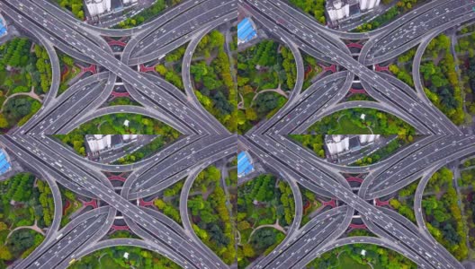 公路交汇处鸟瞰图的时间间隔，形状为字母x十字。桥、路以树为交通理念。中国上海市区建筑的结构形态。高清在线视频素材下载