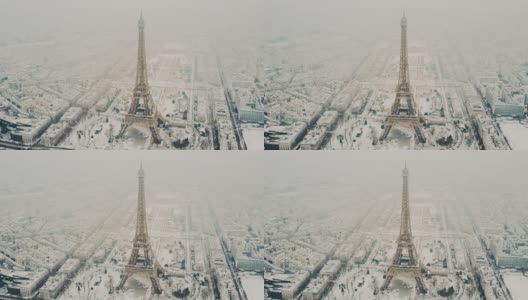 空中游览埃菲尔铁塔，雪天下的巴黎高清在线视频素材下载