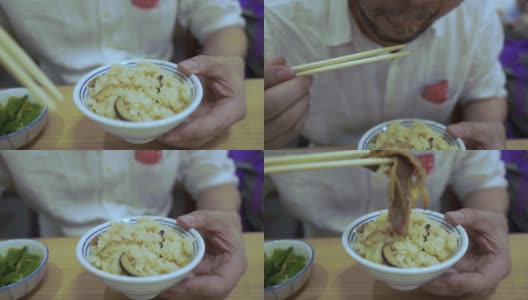 成熟的商人用筷子吃饭高清在线视频素材下载