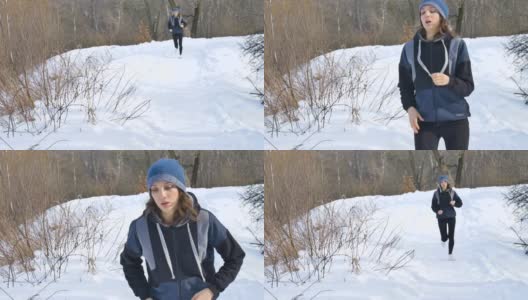 穿着深色运动服跑步的年轻女孩正在城市公园里穿着冬季羊毛衫慢跑。健康与健身理念。高清在线视频素材下载