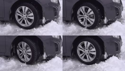 慢镜头:汽车陷在雪地里高清在线视频素材下载