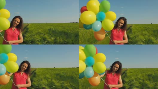 在麦田里拿着气球的女孩高清在线视频素材下载