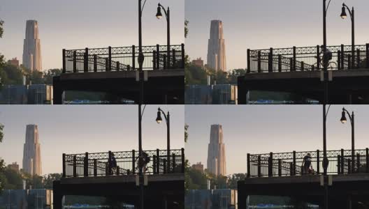 清晨骑自行车的人在热金属街桥上高清在线视频素材下载