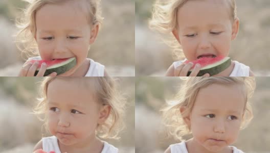 小可爱的小女孩在日出时吃红西瓜的特写高清在线视频素材下载