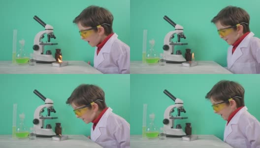小男孩正在用火做化学实验高清在线视频素材下载