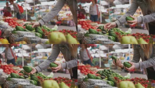 年轻迷人的女人选择有机水果和蔬菜在农贸市场，近距离拍摄高清在线视频素材下载