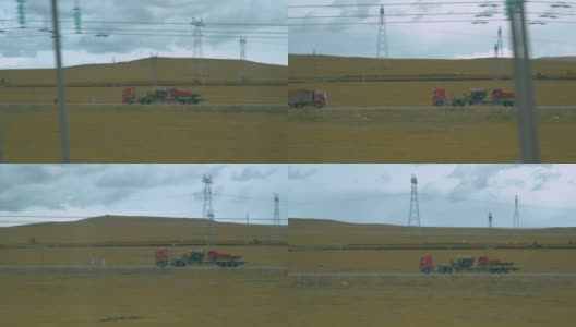 电线挡住了一辆卡车在西藏平原上行驶的视线高清在线视频素材下载