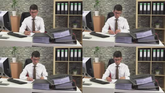 办公室里英俊年轻的商人高清在线视频素材下载