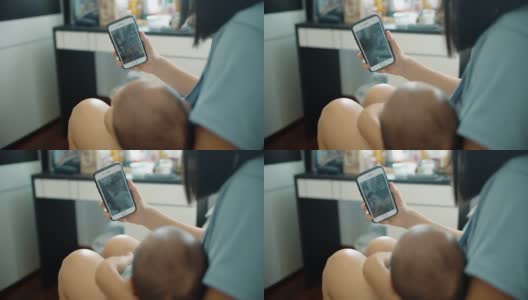 单身妈妈和她的儿子用手机视频聊天高清在线视频素材下载