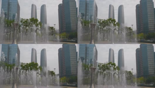 白天时间成都市中心著名的写字楼商场喷泉广场全景4k中国高清在线视频素材下载