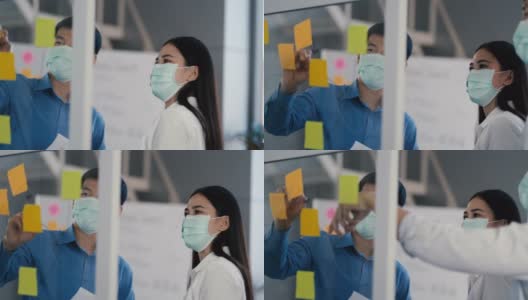 肖像组的亚洲在医疗标志在一个多样化的团队的创造性千禧同事在创业头脑风暴的策略。三个商务人士在办公室开会时一起工作。高清在线视频素材下载