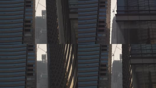 青岛市区日落时分，市中心现代化办公大楼前慢镜头全景4k中国高清在线视频素材下载