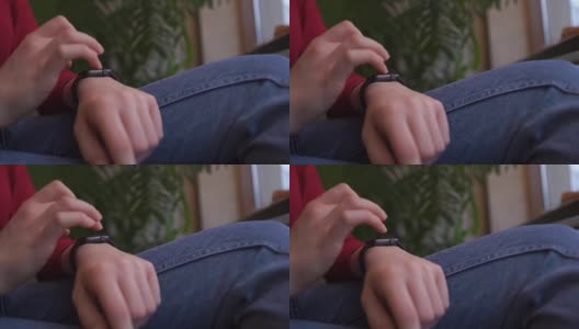 女人的手按在触摸屏上调整手腕上的智能手表高清在线视频素材下载