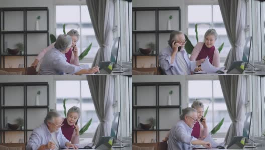 老的资深亚洲退休企业家在家里一起工作，在家隔离远程工作，用台式电脑和智能手机技术设备在家工作高清在线视频素材下载