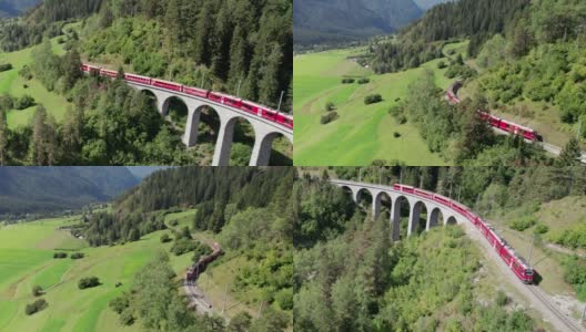 一列红色列车在瑞士阿尔卑斯山的Landwasser高架桥上行驶的鸟瞰图高清在线视频素材下载