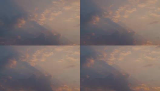 日落时，太阳光线穿过云层。自然背景:太阳光线在云层后面。高清在线视频素材下载
