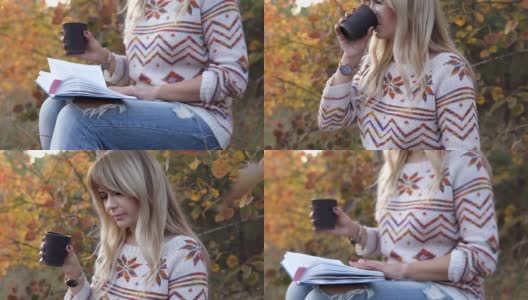 女孩在秋天的公园里看书，喝着热饮高清在线视频素材下载