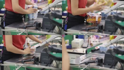 超市店员在超市扫描条码产品。高清在线视频素材下载