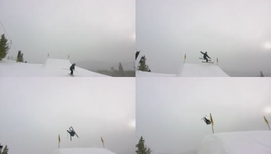 一个滑雪者穿着完整的冬季装备完成一个“开关Rodeo 5”的技巧在滑雪跑在埃尔多拉滑雪度假村附近的博尔德，科罗拉多州在一个下雪的，阴天高清在线视频素材下载