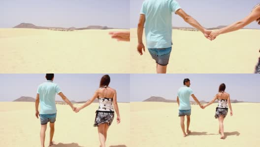 在科拉雷霍自然公园，一对孤独的夫妇手牵着手走在空旷的沙丘上高清在线视频素材下载