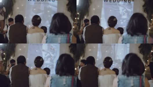 新婚夫妇在婚礼上看电影。高清在线视频素材下载