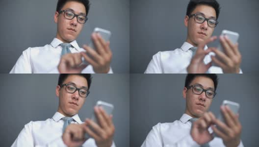 使用智能手机的亚洲人，他是社交成瘾者高清在线视频素材下载
