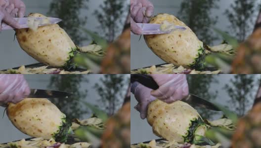 女性手剥菠萝的特写。高清在线视频素材下载
