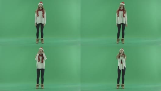 性感年轻的美丽在圣诞帽送空气吻，色度键的背景高清在线视频素材下载