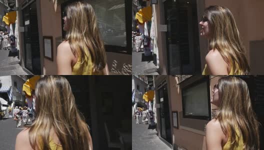 意大利阿马尔菲大街上的一名女游客高清在线视频素材下载
