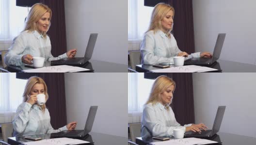 微笑的女孩在电脑后面工作，打一个视频电话高清在线视频素材下载