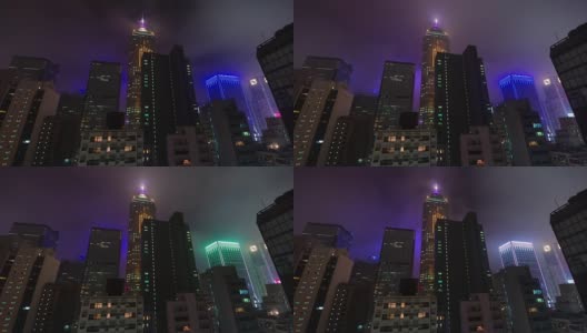 夜光多云的天空4k时间从香港的高楼大厦高清在线视频素材下载