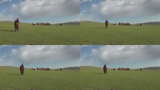 一个家庭在蒙古的草地上搭建蒙古包帐篷高清在线视频素材下载