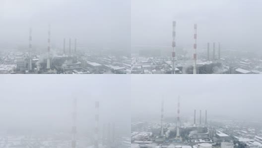 冬季多雾的火电厂烟囱。高清在线视频素材下载