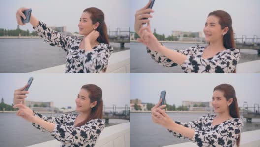 MCU——迷人的亚洲女人在度假时用手机自拍。高清在线视频素材下载