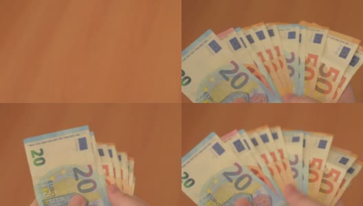 男人手上扇形的一叠欧元钞票高清在线视频素材下载