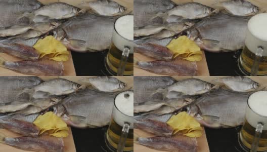 啤酒头安置在一个玻璃马克杯上，背景是鳕鱼高清在线视频素材下载
