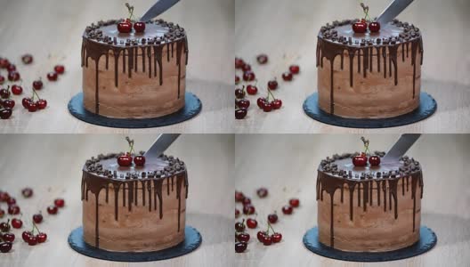 巧克力蛋糕配樱桃和巧克力奶油。高清在线视频素材下载