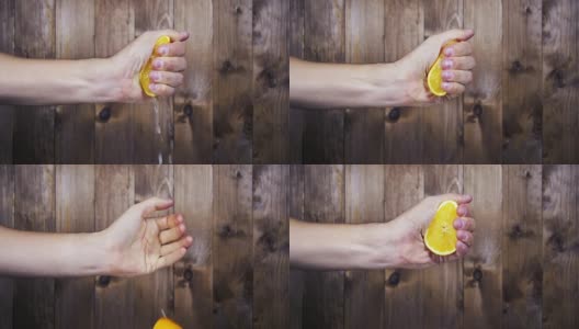 用手把橙汁挤出来。慢动作高清在线视频素材下载