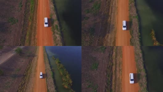 汽车在土路上行驶的鸟瞰图高清在线视频素材下载