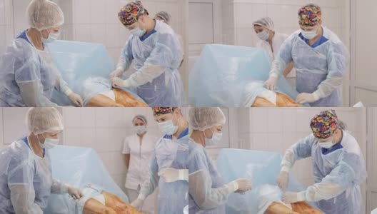 手术小组在医院手术室为病人做手术准备。高清在线视频素材下载
