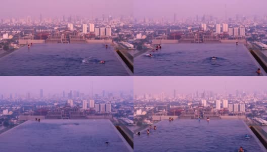 人们在游泳池游泳的时间流逝与城市景观和紫色天空的城市景观与紫外线的概念高清在线视频素材下载