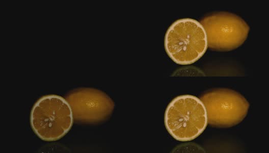 多汁的柠檬在黑暗的背景。高清高清在线视频素材下载
